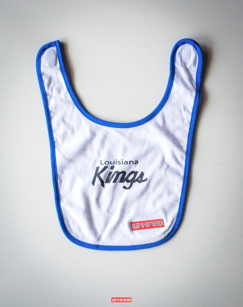 “Louisiana Queens” Baby Bibs (White/Royal Trim)